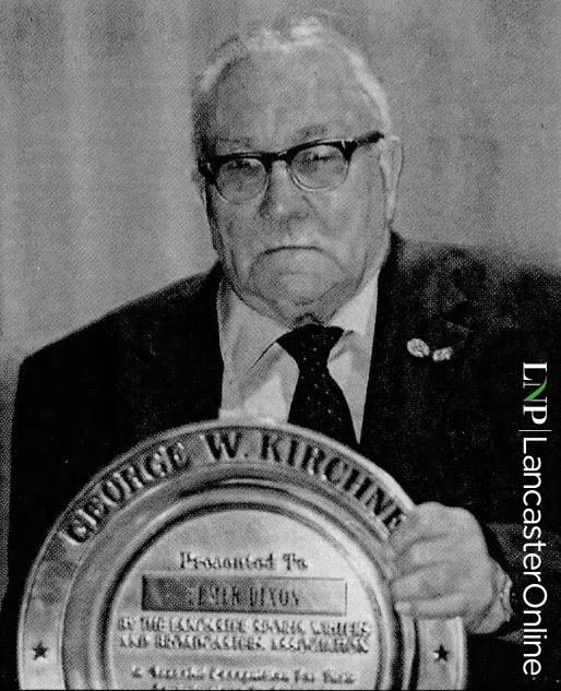 Elmer Dixon with award