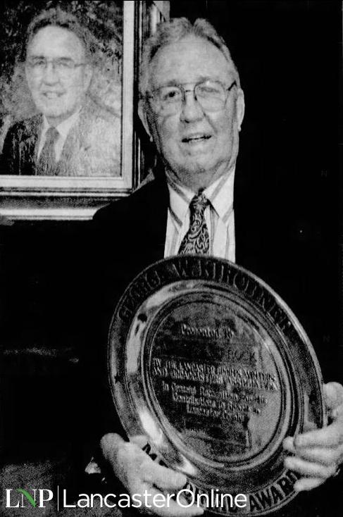 Milt Finefrock with award